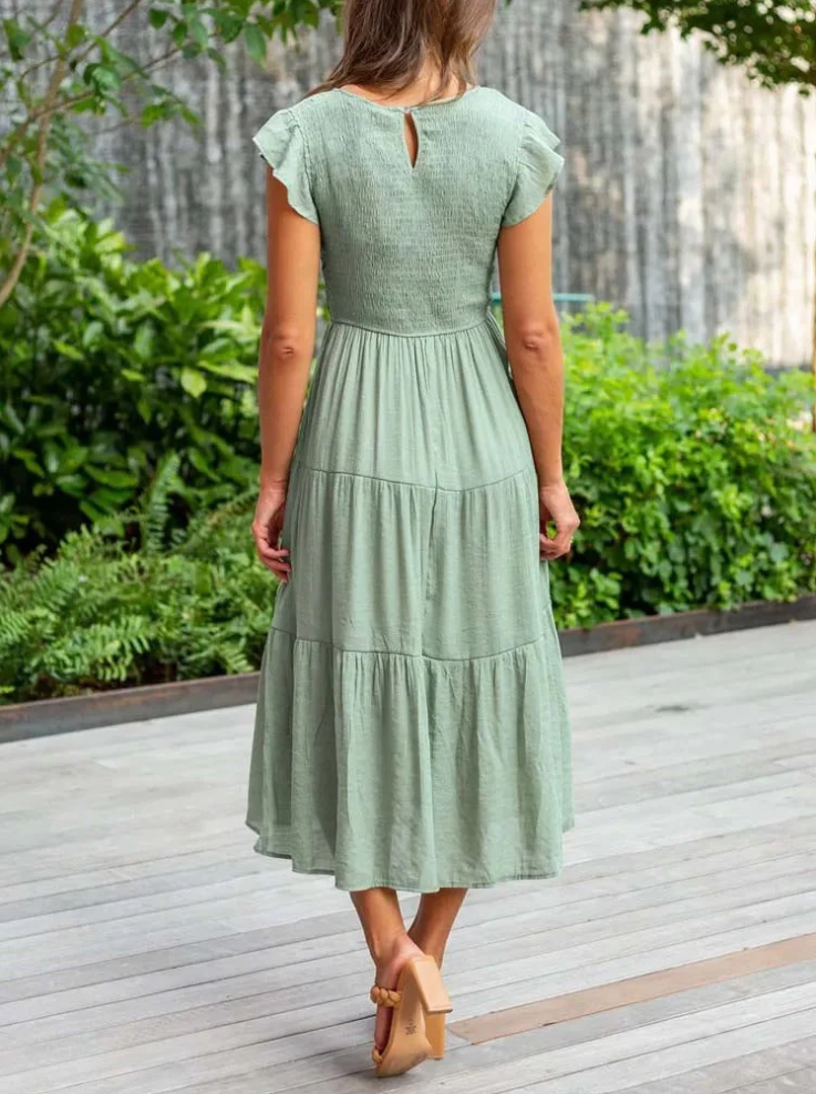 Elegantes sommerkleid - rüschendetails, taschen