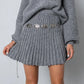 Elegantes set aus plissee-pullover und rock - jayline
