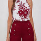 Abigail – elegantes set aus neckholder-top und shorts mit blumenmuster und bindeband