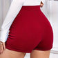 Olivia – shorts mit hohem bund und knopfdekor